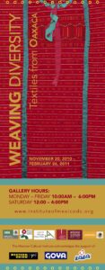 Tall banner including a red textile pattern with green lines for an exhibition called "Weaving Diversity: Textiles from Oaxaca."